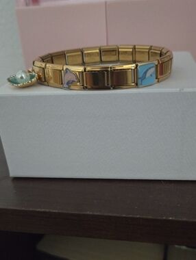 Bella Vita Gold Stretch Bracelet with Blue Dolphin and Pink Accent Charms